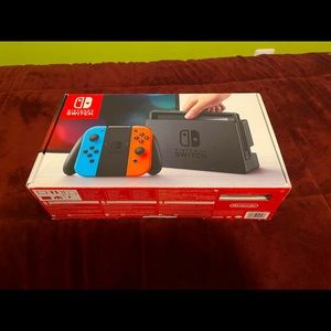 nintendo switch with case and controller